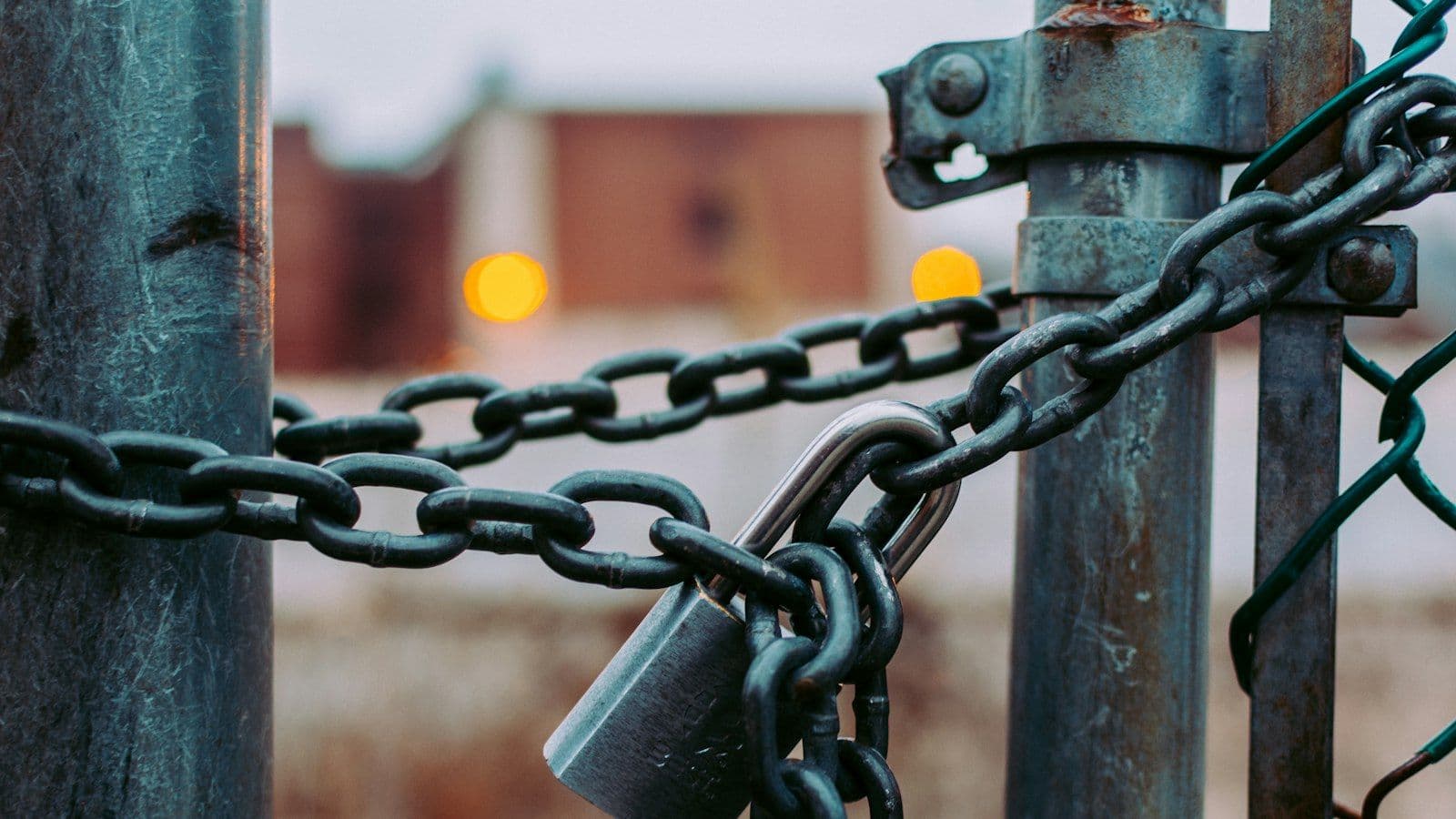 Padlock on a chained gate