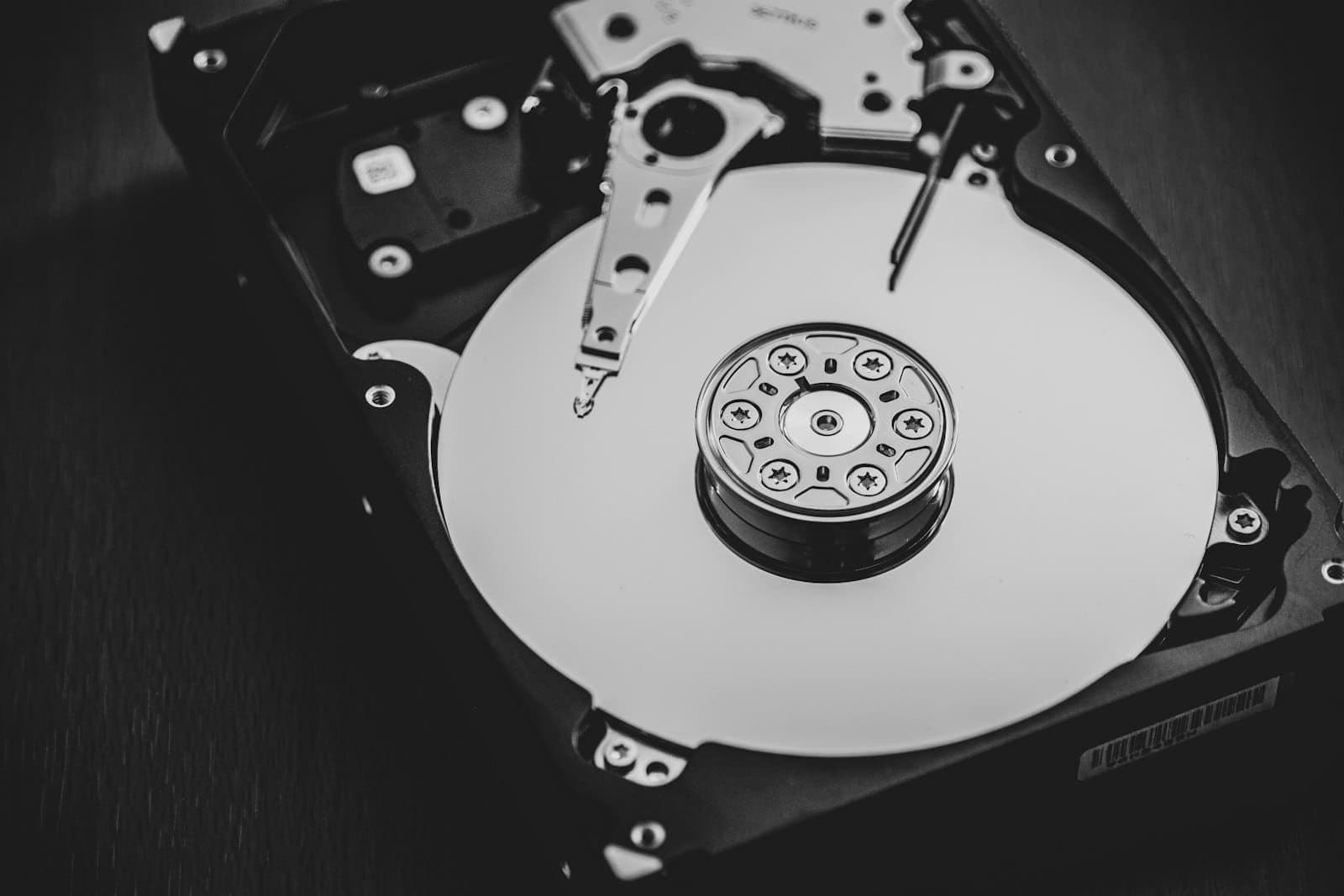 Open hard disk drive in black and white